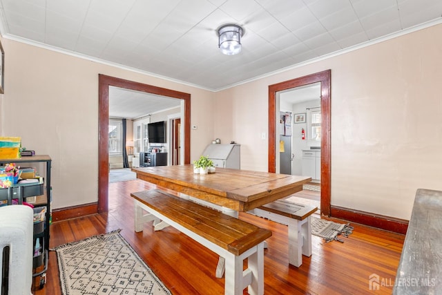 54 5th St, Fords, NJ 08863 - dining area featuring hardwood / wood-style floors, baseboards, and crown molding