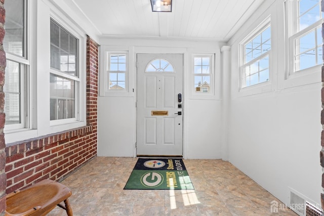 54 5th St, Fords, NJ 08863 - entryway with stone finish flooring, wooden ceiling, and brick wall