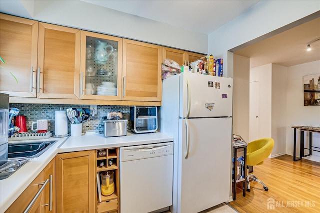 521 Andria Ave Unit 202, Hillsborough, NJ 08844 - kitchen featuring white appliances, light countertops, decorative backsplash, light wood finished floors, and glass insert cabinets