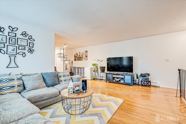 521 Andria Ave Unit 202, Hillsborough, NJ 08844 - living area featuring light wood-style flooring and a baseboard radiator