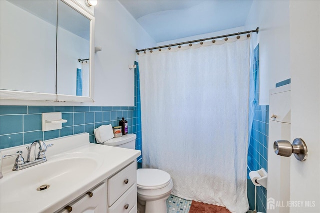 521 Andria Ave Unit 202, Hillsborough, NJ 08844 - bathroom with tile walls, toilet, vanity, a wainscoted wall, and a shower with curtain