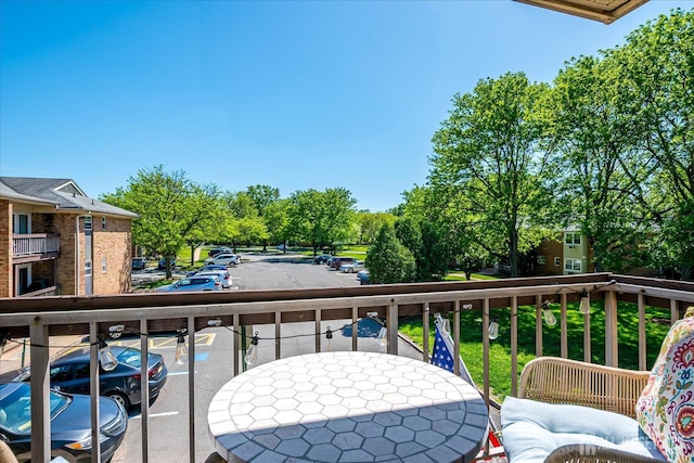 521 Andria Ave Unit 202, Hillsborough, NJ 08844 - balcony with outdoor dining space and view of scattered trees
