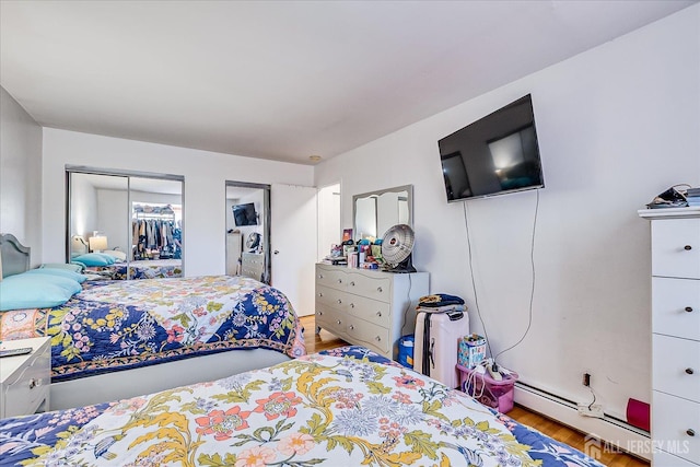 521 Andria Ave Unit 202, Hillsborough, NJ 08844 - bedroom with wood finished floors, baseboard heating, and a closet