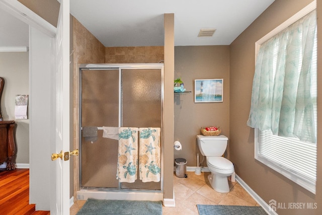 445 Grace Hill Rd, Monroe, NJ 08831 - full bathroom with baseboards, tile patterned floors, toilet, a shower stall, and visible vents