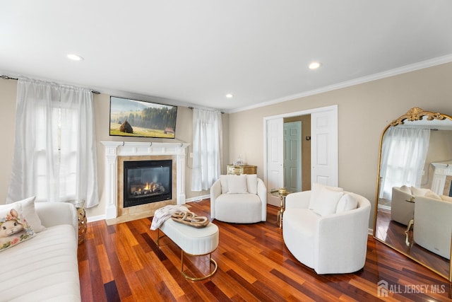 445 Grace Hill Rd, Monroe, NJ 08831 - living area featuring crown molding, wood finished floors, plenty of natural light, and a tile fireplace