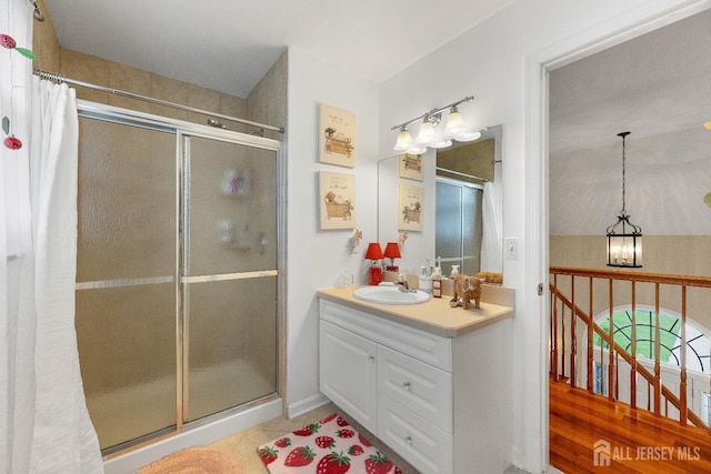 445 Grace Hill Rd, Monroe, NJ 08831 - bathroom with tile patterned flooring, an inviting chandelier, a stall shower, and vanity