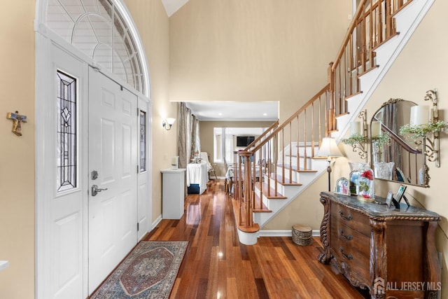 445 Grace Hill Rd, Monroe, NJ 08831 - foyer entrance with baseboards, plenty of natural light, a high ceiling, stairs, and wood finished floors