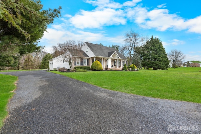 445 Grace Hill Rd, Monroe, NJ 08831 - view of front facade with a front yard, covered porch, and driveway
