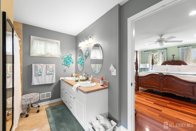 445 Grace Hill Rd, Monroe, NJ 08831 - bathroom featuring baseboards, visible vents, a ceiling fan, vanity, and connected bathroom
