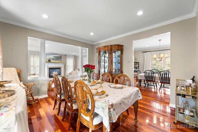 445 Grace Hill Rd, Monroe, NJ 08831 - dining area featuring hardwood / wood-style floors, crown molding, a glass covered fireplace, and recessed lighting