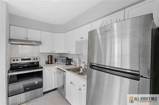 kitchen with white cabinetry, sink, tasteful backsplash, and appliances with stainless steel finishes