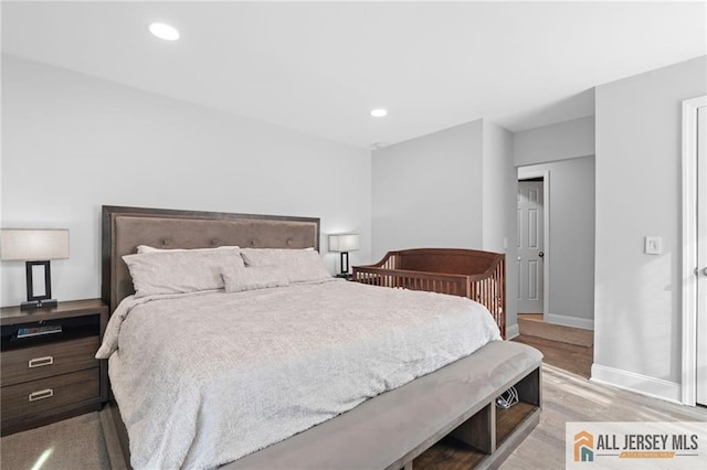 bedroom with light hardwood / wood-style flooring