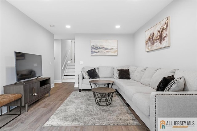 living room with light hardwood / wood-style flooring