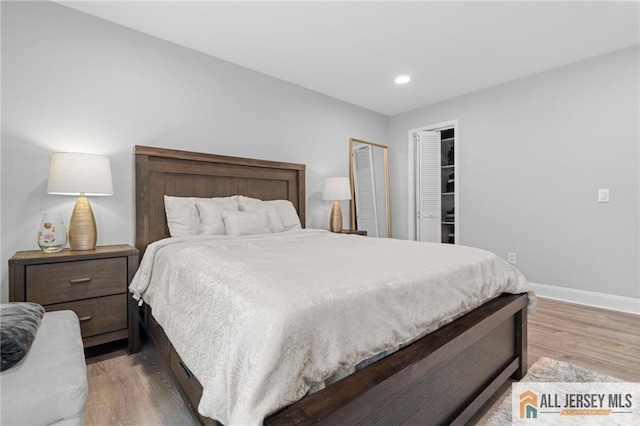 bedroom with hardwood / wood-style flooring