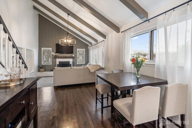 1 York St, Old Bridge, NJ 08857 - dining space featuring dark wood finished floors, stairway, a chandelier, and a fireplace