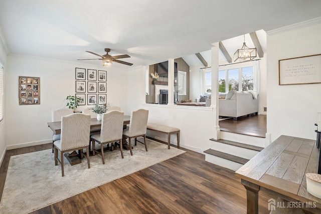 1 York St, Old Bridge, NJ 08857 - dining room featuring a chandelier, ornamental molding, dark wood-style flooring, a fireplace, and ceiling fan