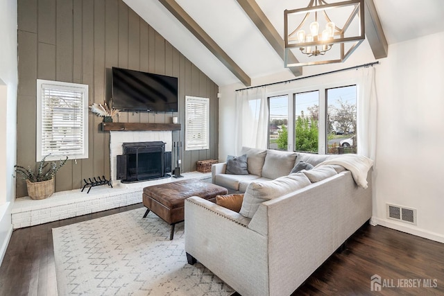 1 York St, Old Bridge, NJ 08857 - living room featuring wood finished floors, a chandelier, healthy amount of natural light, baseboards, and beamed ceiling