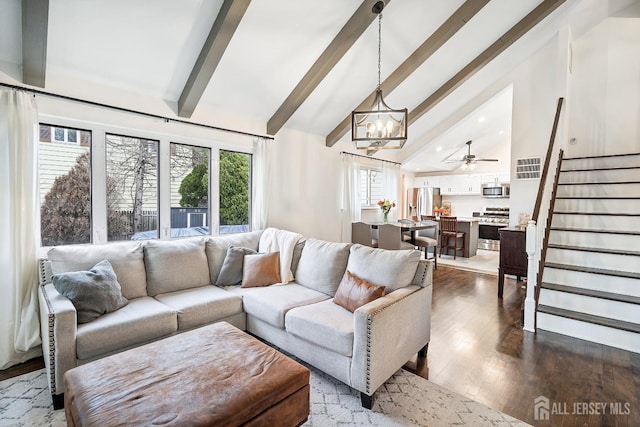 1 York St, Old Bridge, NJ 08857 - living area with stairs, a chandelier, beam ceiling, dark wood-style floors, and high vaulted ceiling