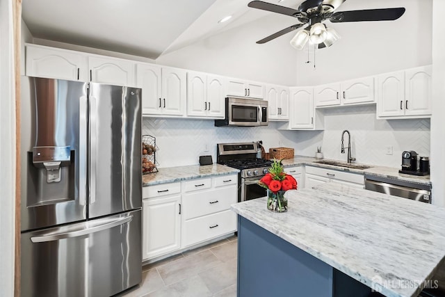1 York St, Old Bridge, NJ 08857 - kitchen featuring stainless steel appliances, a sink, light stone counters, a ceiling fan, and white cabinets