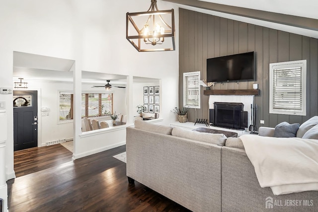 1 York St, Old Bridge, NJ 08857 - living room with a chandelier, dark wood finished floors, a fireplace, baseboard heating, and high vaulted ceiling