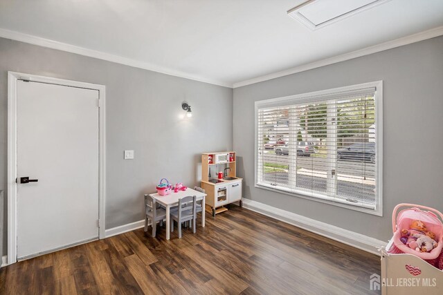 1 York St, Old Bridge, NJ 08857 - rec room with crown molding, wood finished floors, and baseboards