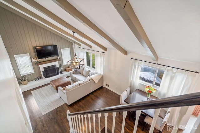 1 York St, Old Bridge, NJ 08857 - living area featuring dark wood-style flooring, a fireplace with raised hearth, baseboards, and wooden walls