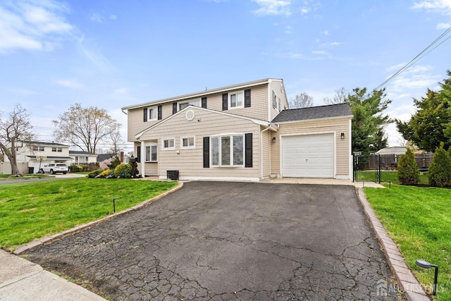 1 York St, Old Bridge, NJ 08857 - view of front of home with a garage and asphalt driveway