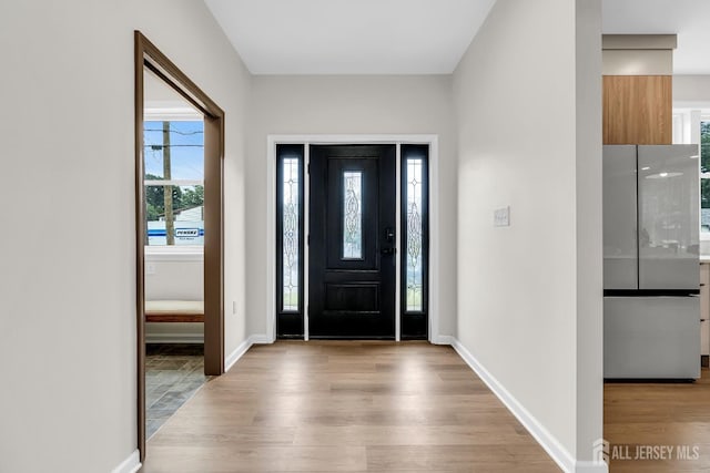 35 Glenville Rd, Edison, NJ 08817 - entryway with light wood-type flooring and baseboards