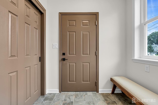 35 Glenville Rd, Edison, NJ 08817 - doorway featuring baseboards and stone finish flooring