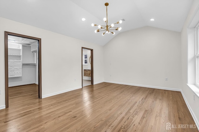 35 Glenville Rd, Edison, NJ 08817 - unfurnished living room with a chandelier, lofted ceiling, light wood-type flooring, and recessed lighting