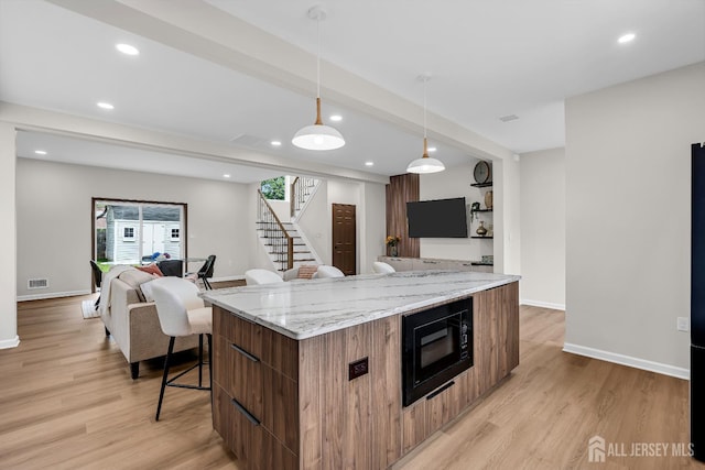 35 Glenville Rd, Edison, NJ 08817 - kitchen featuring black microwave, modern cabinets, open floor plan, a breakfast bar area, and recessed lighting