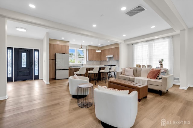 35 Glenville Rd, Edison, NJ 08817 - living area with light wood finished floors and recessed lighting