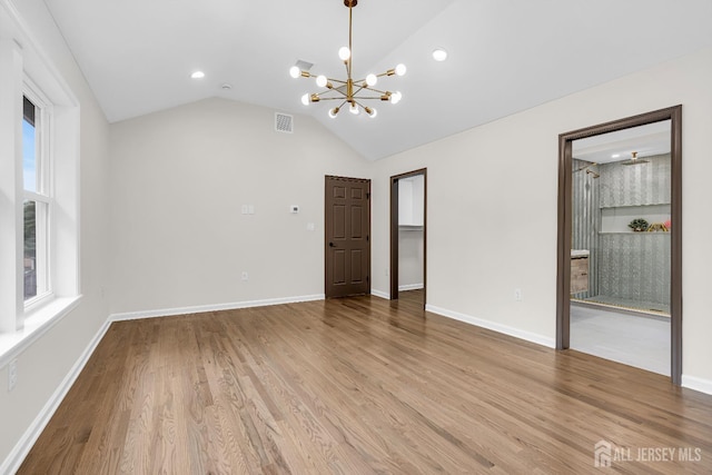 35 Glenville Rd, Edison, NJ 08817 - unfurnished living room with a chandelier, wood finished floors, vaulted ceiling, and recessed lighting