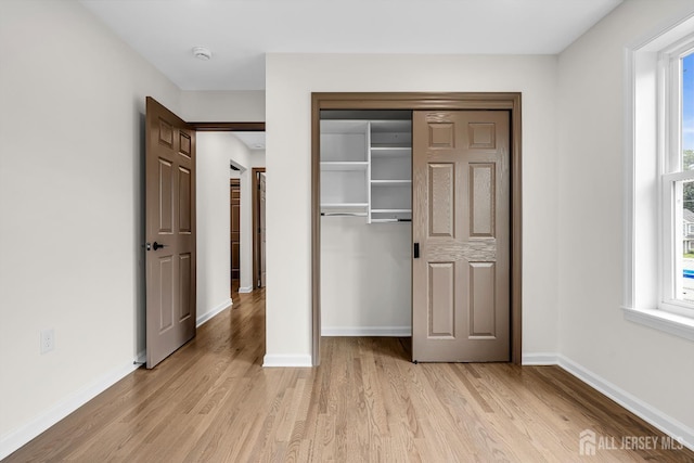 35 Glenville Rd, Edison, NJ 08817 - unfurnished bedroom featuring light wood-type flooring, multiple windows, and a closet