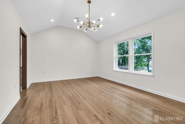 35 Glenville Rd, Edison, NJ 08817 - spare room with a chandelier, wood finished floors, vaulted ceiling, and recessed lighting