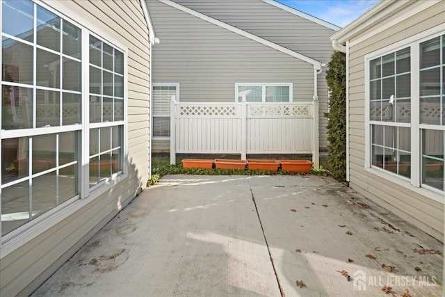 view of patio / terrace featuring fence