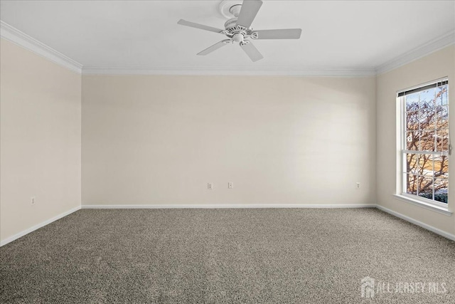 spare room featuring baseboards, carpet, ornamental molding, and a ceiling fan