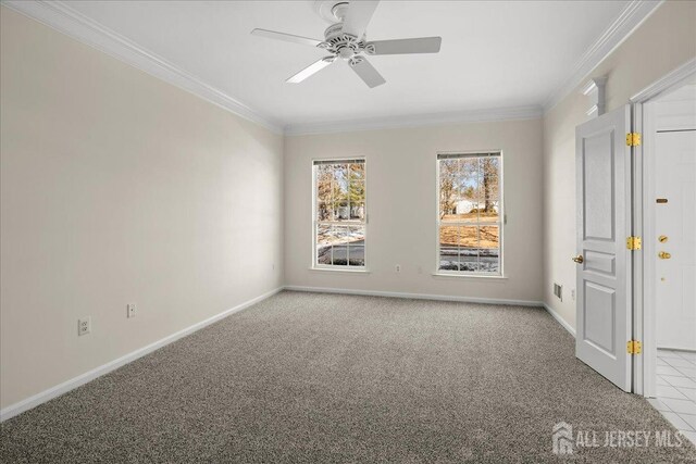 carpeted empty room with crown molding and ceiling fan