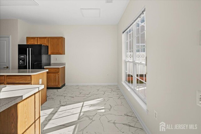 kitchen featuring black fridge