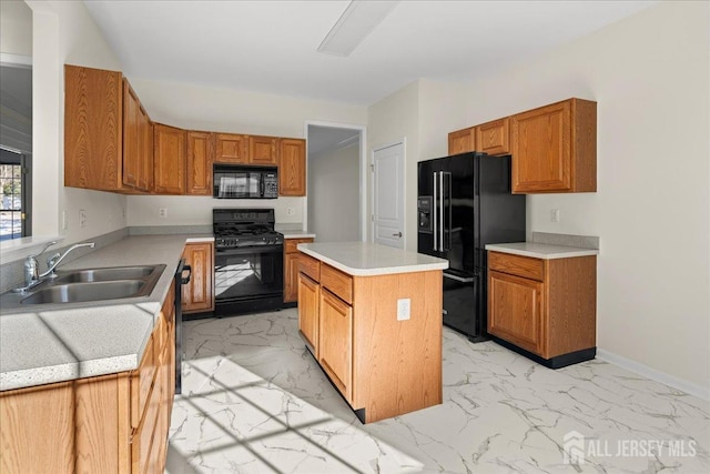 kitchen with a center island, sink, and black appliances