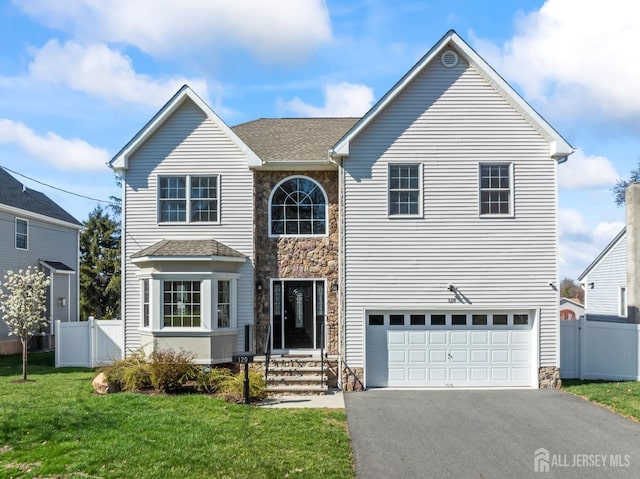 120 Normandy Rd, Colonia, NJ 07067 - traditional home with stone siding, driveway, a garage, and roof with shingles