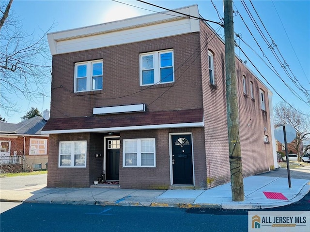 view of front of house featuring brick siding