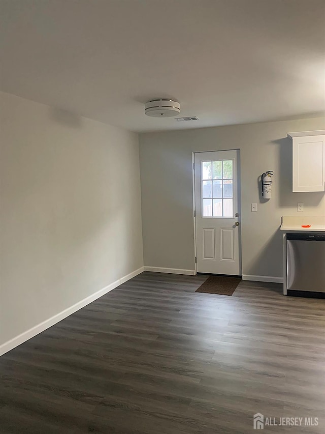 entryway with visible vents, baseboards, and dark wood-style flooring