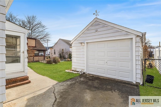 garage with a yard