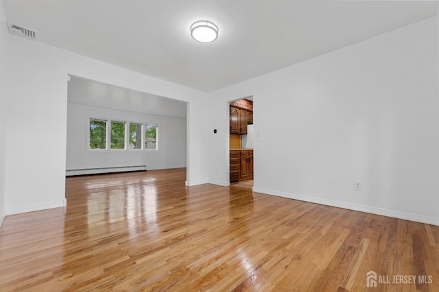 40 Montclair Ave, Edison, NJ 08820 - empty room featuring a baseboard radiator, light wood finished floors, and baseboards