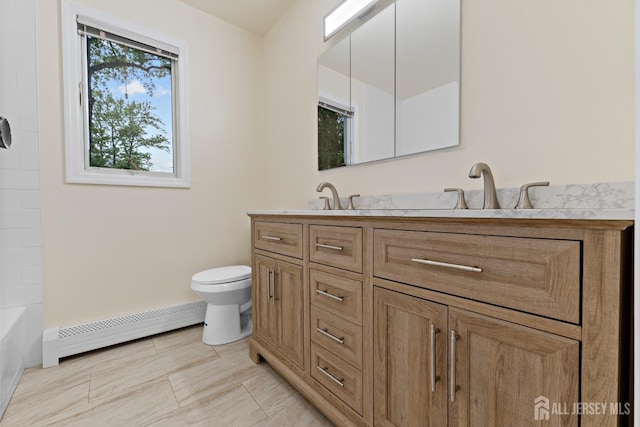 40 Montclair Ave, Edison, NJ 08820 - bathroom with a baseboard radiator, double vanity, toilet, and baseboards