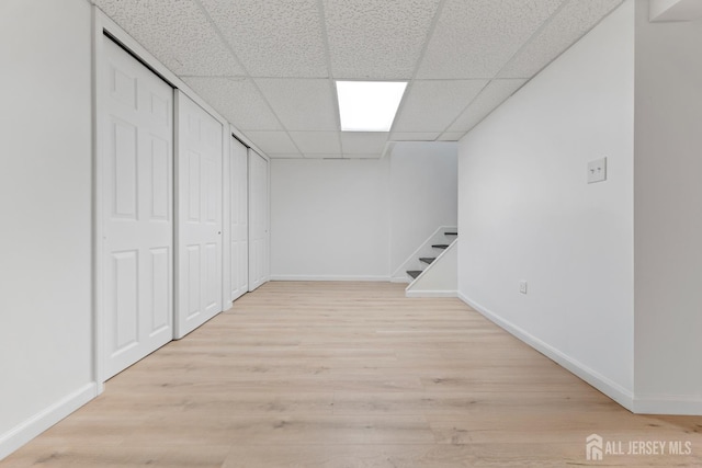 40 Montclair Ave, Edison, NJ 08820 - finished below grade area featuring baseboards, light wood finished floors, and a paneled ceiling