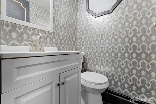 40 Montclair Ave, Edison, NJ 08820 - bathroom featuring wallpapered walls, toilet, and vanity