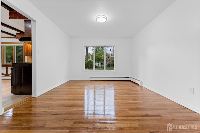 40 Montclair Ave, Edison, NJ 08820 - unfurnished room featuring wood finished floors, a baseboard radiator, and baseboards