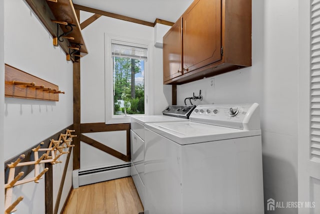 40 Montclair Ave, Edison, NJ 08820 - laundry room featuring a baseboard radiator, cabinet space, light wood-style floors, and washer and clothes dryer